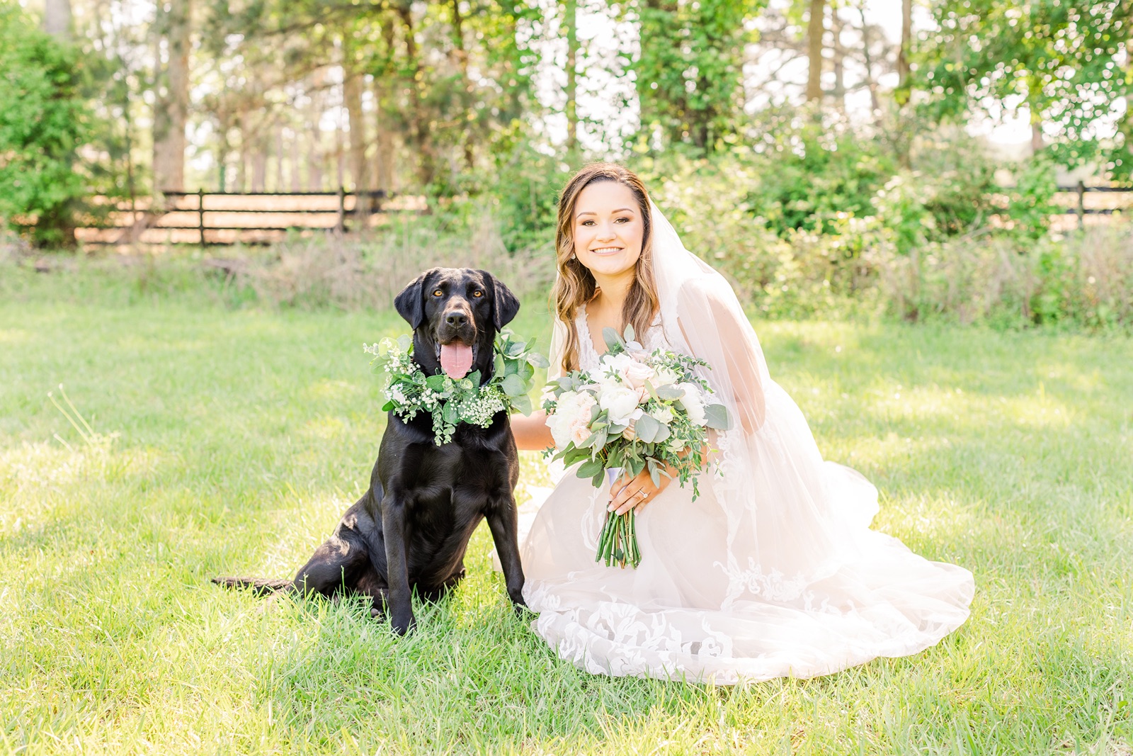 Bride and her black Labrador Retriever on a sunny spring day